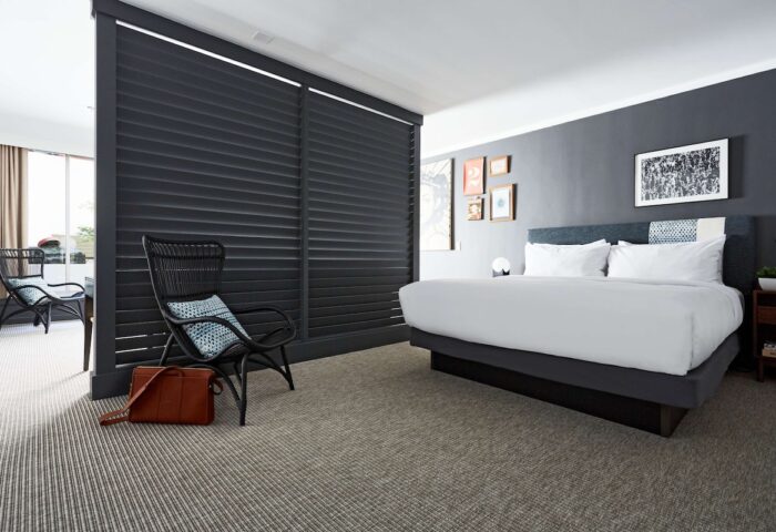 Hotel Kabuki, part of Jdv By Hyatt, gay-friendly hotel room. Room divider, king bed, and seating area for a relaxing stay.