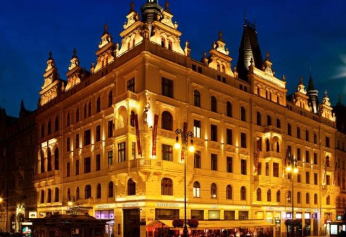 Hotel Kings Court, a gay-friendly hotel. Night view of the illuminated facade. A top choice for gay men's travel, offering luxury & comfort.