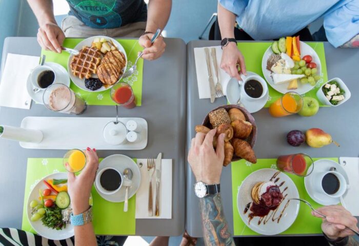 Breakfast at gay-friendly Hotel Ku'Damm 101. Guests enjoy waffles, pancakes, fruit, and pastries. A delicious start to the day!