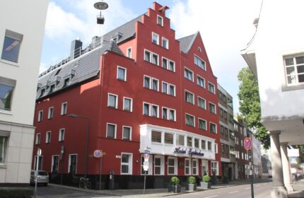 Hotel Lyskirchen, a gay-friendly hotel. Exterior view of the red brick building with unique architecture in Cologne. A great choice for gay travel.