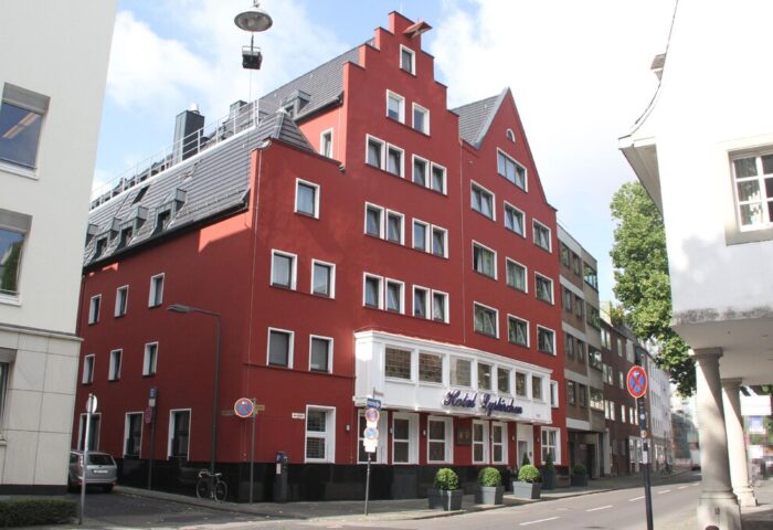 Hotel Lyskirchen, a gay-friendly hotel. Exterior view of the red brick building with unique architecture in Cologne. A great choice for gay travel.