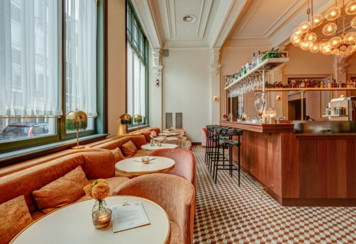 Hotel Mercier's gay-friendly bar area. Plush seating, elegant bar, and stylish decor create a welcoming atmosphere. Ideal for gay travelers.