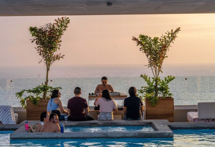 Gay-Friendly Hotel Mio Vallarta Adults Only pool party with DJ. Ocean view at sunset. Perfect for gay travel & vacations in Puerto Vallarta.