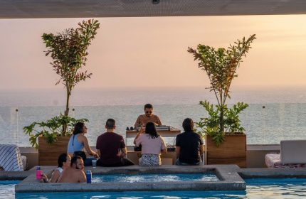 Gay-Friendly Hotel Mio Vallarta Adults Only pool party with DJ. Ocean view at sunset. Perfect for gay travel & vacations in Puerto Vallarta.
