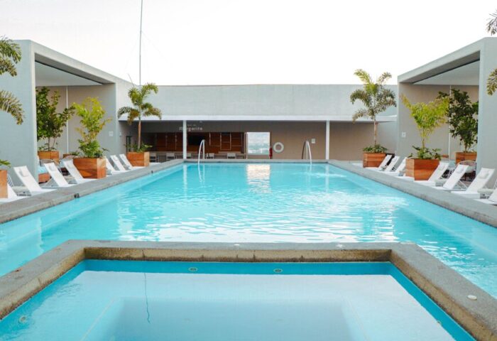 Hotel Mio Vallarta Adults Only gay-friendly hotel pool. Loungers line the pool deck at this gay hotel in Vallarta, Mexico.