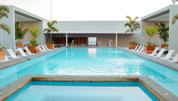 Hotel Mio Vallarta Adults Only gay-friendly hotel pool. Loungers line the pool deck at this gay hotel in Vallarta, Mexico.