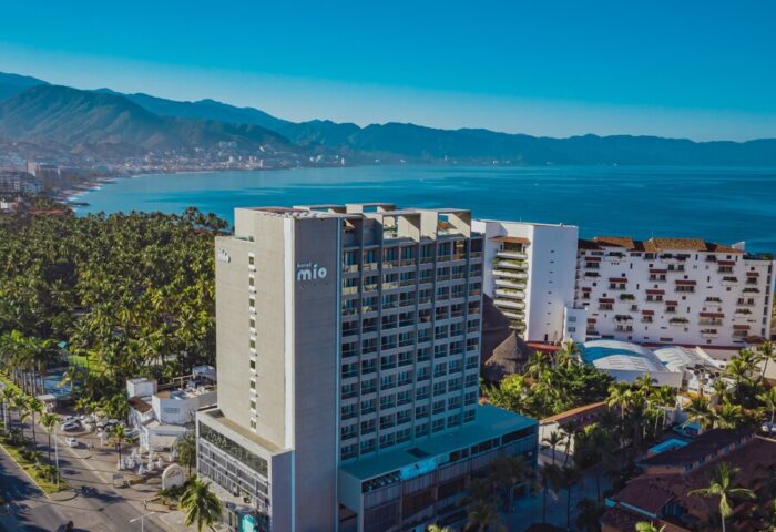 Aerial view of Hotel Mio Vallarta, an adults-only, gay-friendly hotel in Puerto Vallarta, Mexico, with ocean and mountain views.