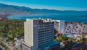 Aerial view of Hotel Mio Vallarta, an adults-only, gay-friendly hotel in Puerto Vallarta, Mexico, with ocean and mountain views.