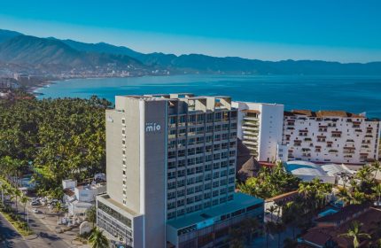 Aerial view of Hotel Mio Vallarta, an adults-only, gay-friendly hotel in Puerto Vallarta, Mexico, with ocean and mountain views.