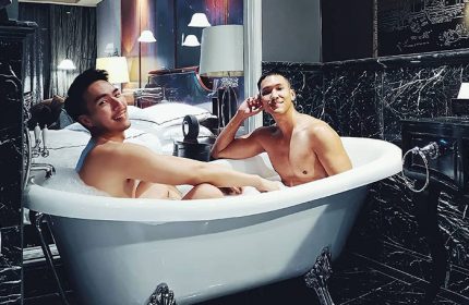 Gay couple in a bubble bath at Hotel Muse Bangkok Langsuan, MGallery Collection. Gay-friendly hotel, luxury travel.