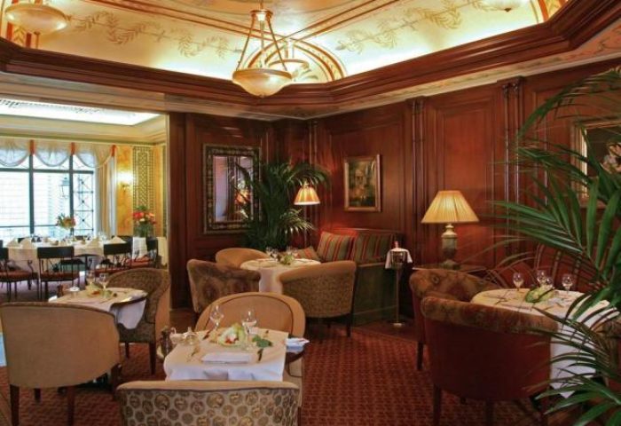 Hotel Napoleon's elegant dining room. Gay-friendly, pet-friendly hotel with tables set for dining. Fine dining experience.