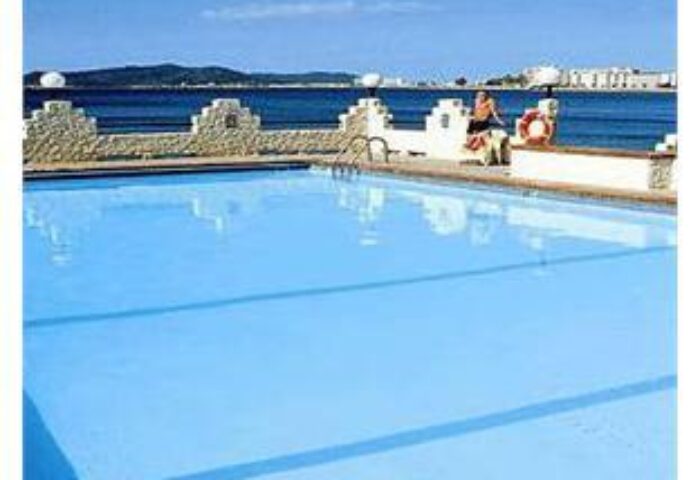 Hotel Nautico Ebeso's pool overlooking the ocean. This gay-friendly hotel offers a relaxing and welcoming atmosphere for gay men travelers.