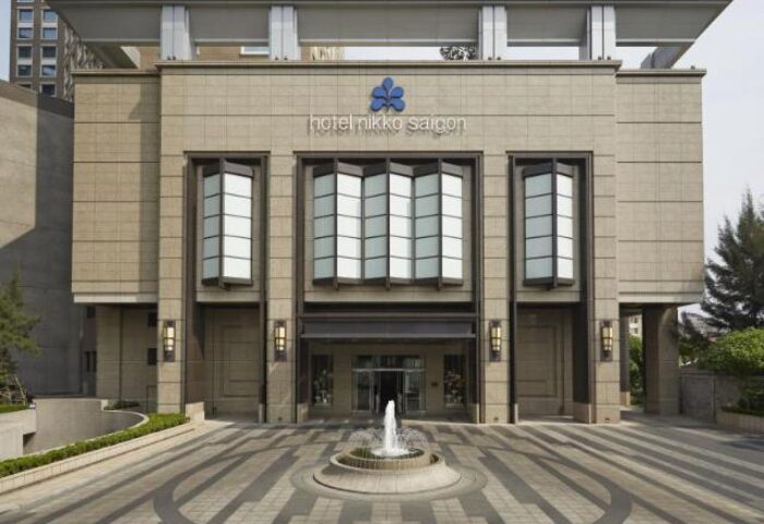 Hotel Nikko Saigon entrance. Gay-friendly hotel in Saigon with modern architecture and a fountain. Great for gay travelers in Vietnam.