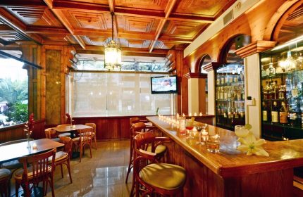 Hotel PF's bar interior. Gay-friendly Hotel PF features a classic wood bar, tables, and a relaxing atmosphere. Perfect for gay travelers.