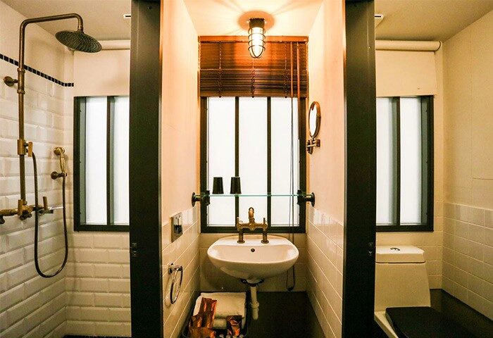 Hotel PaPa Whale gay-friendly hotel bathroom. Shower, sink, and toilet in a modern, stylish design. Perfect for gay travel.