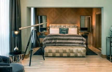 Hotel Palace Berlin's pet-friendly room. Gay-friendly hotel with bed, telescope, and luxurious decor. Ideal for gay men travel.
