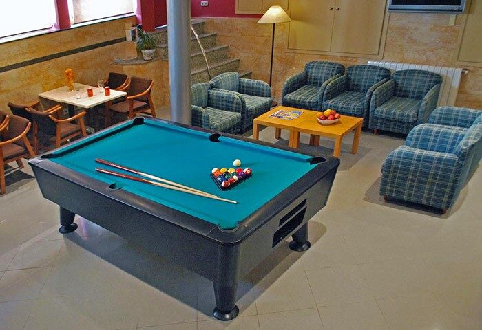 Hotel Piccadilly Sitges gay-friendly hotel: Billiard table and lounge area. A great place to relax and socialize in Sitges' gay scene.
