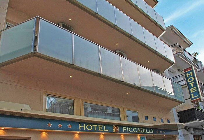 Hotel Piccadilly Sitges facade. Gay-friendly hotel with modern glass balconies. A popular choice for gay men visiting Sitges, Spain.