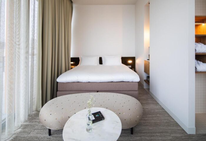 Hotel Pontsteiger's gay-friendly room. Modern design, king bed, marble table, and stylish decor. Perfect for gay travelers seeking luxury.