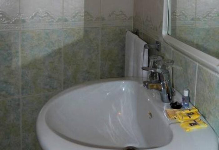 Hotel Queens Adults Only By Mc bathroom sink. Gay-friendly hotel interior. Adults-only accommodation detail. Travel advice for gay men.