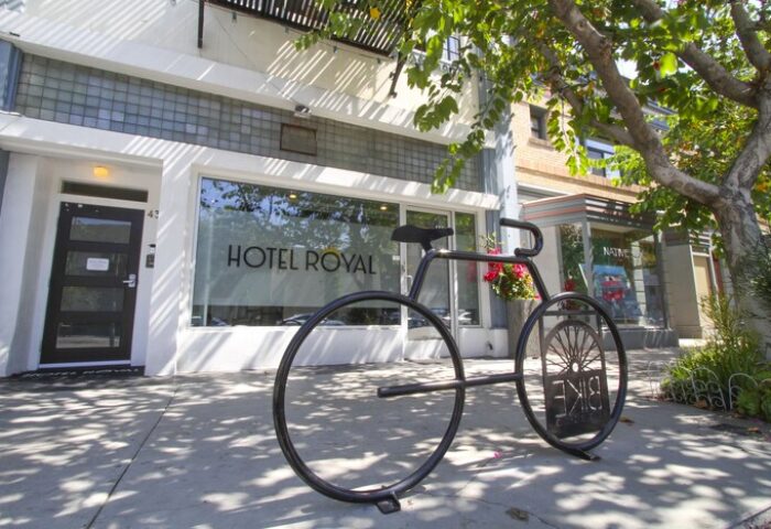 Hotel Royal, a gay-friendly hotel. Bike rack in front of the entrance. The hotel's name is on the window. Great choice for gay men travelers.