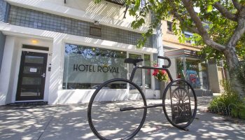 Hotel Royal, a gay-friendly hotel. Bike rack in front of the entrance. The hotel's name is on the window. Great choice for gay men travelers.