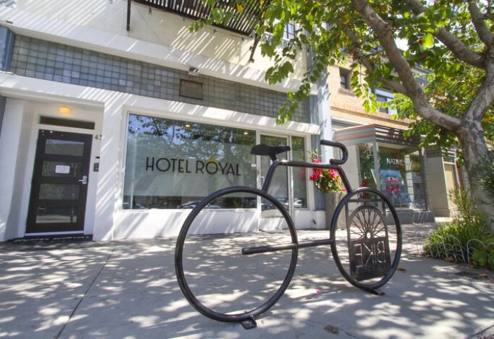 Hotel Royal, a gay-friendly hotel. Bike rack in front of the entrance. The hotel's name is on the window. Great choice for gay men travelers.