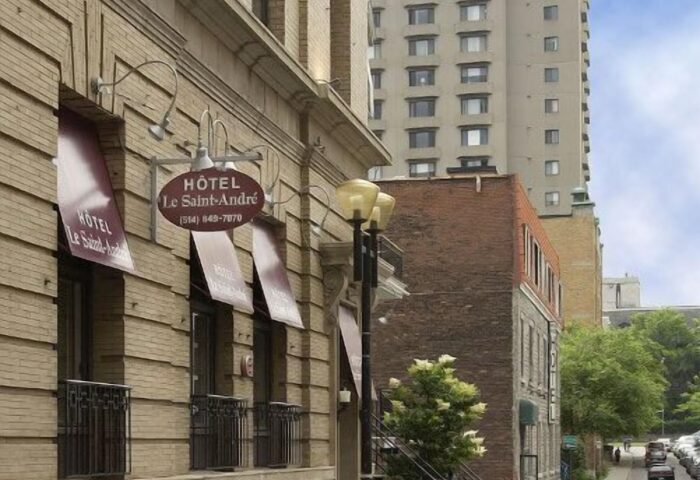 Hotel Saint-Andre, a gay-friendly hotel in Montreal. The building's facade features awnings and a sign with the hotel's name. Street view.