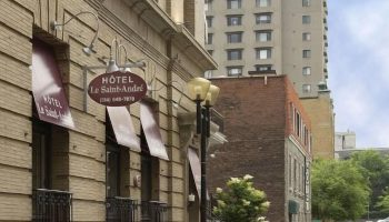 Hotel Saint-Andre, a gay-friendly hotel in Montreal. The building's facade features awnings and a sign with the hotel's name. Street view.