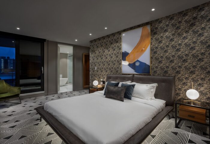 Hotel St. Thomas gay-friendly room. King bed, modern art, & city views. Upscale gay travel experience. Stylish decor. Relaxing vacation.