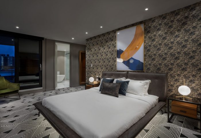 Hotel St. Thomas gay-friendly room. King bed, modern art, & city views. Upscale gay travel experience. Stylish decor. Relaxing vacation.
