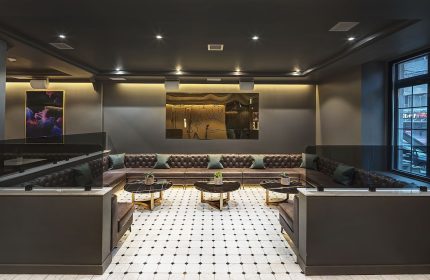 Hotel St. Thomas gay-friendly hotel interior. Modern lounge area with leather seating, artwork, and stylish decor. Luxury gay travel in St. Thomas.