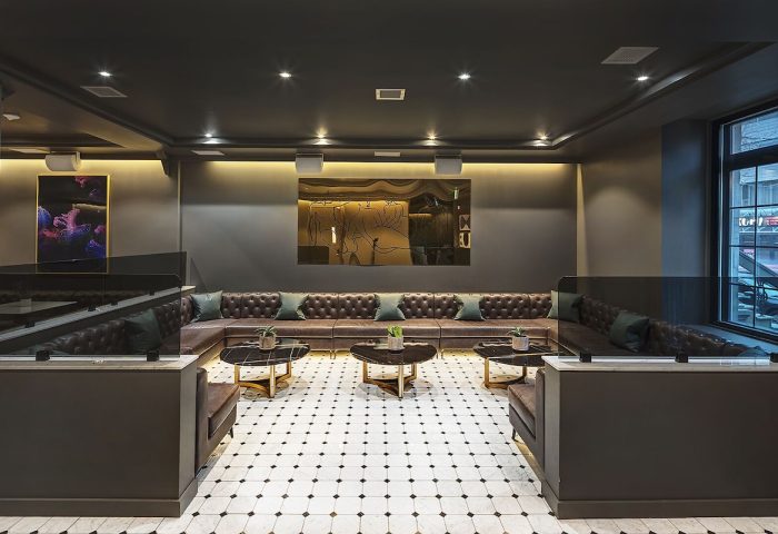 Hotel St. Thomas gay-friendly hotel interior. Modern lounge area with leather seating, artwork, and stylish decor. Luxury gay travel in St. Thomas.