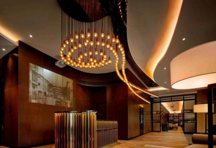 Hotel Stripes Kuala Lumpur, Autograph Collection lobby. Modern design, warm lighting, and stylish reception for gay travelers.
