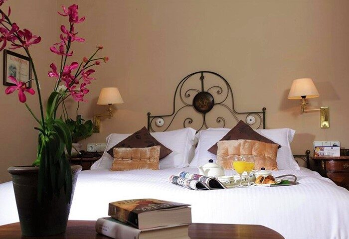 Hotel Subur Maritim's gay-friendly, pet-friendly room. Breakfast in bed with juice, croissants, and coffee. Relaxing travel advice.