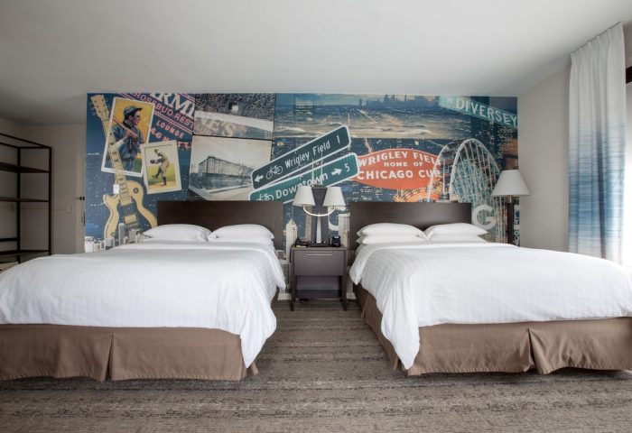 Hotel Versey Chicago Lincoln Park room with two beds. Gay-friendly hotel with a Chicago-themed mural. Great for LGBTQ+ travelers.