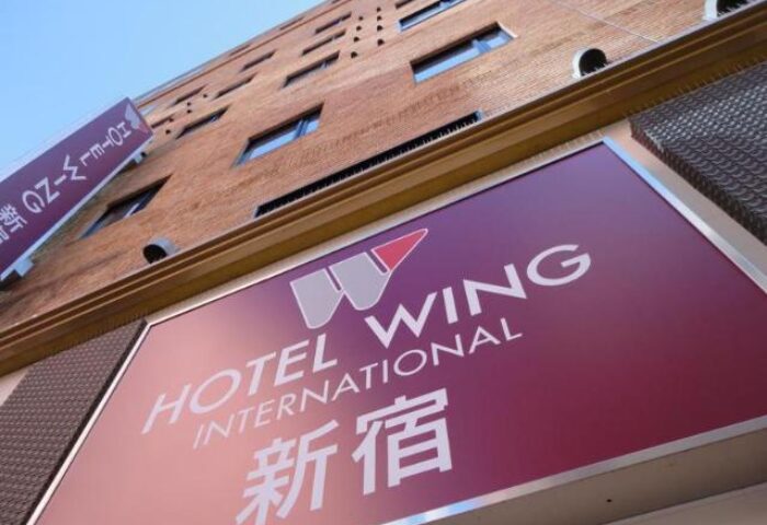 Hotel Wing International Shinjuku signage. Gay-friendly hotel in Shinjuku, Japan. Building exterior with hotel logo.