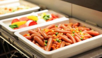 Breakfast buffet at Hotel Wing International Shinjuku, a gay-friendly hotel. Sausages, veggies, and other dishes are available.