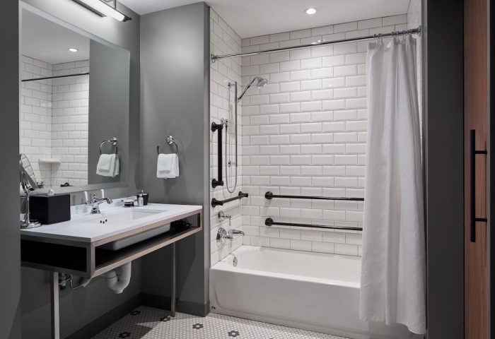Hotel Zachary Chicago bathroom. Accessible features include grab bars, handheld shower, & roll-under sink. Gay-friendly hotel.