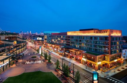 Hotel Zachary, Chicago, a Tribute Portfolio Hotel at night. Gay-friendly hotel near Wrigley Field. Urban landscape with city skyline.