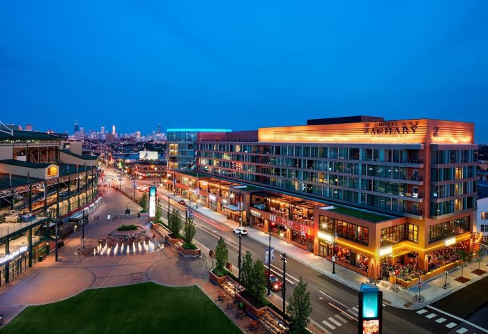 Hotel Zachary, Chicago, a Tribute Portfolio Hotel at night. Gay-friendly hotel near Wrigley Field. Urban landscape with city skyline.