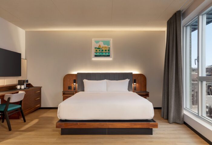 Hyatt Centric Montreal hotel room. Modern design, large bed, city view. Gay-friendly travel lodging option in Montreal, Canada.