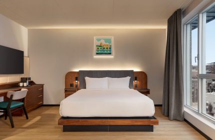 Hyatt Centric Montreal hotel room. Modern design, large bed, city view. Gay-friendly travel lodging option in Montreal, Canada.