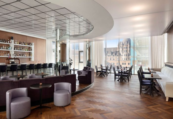 Gay-friendly Hyatt Centric Montreal hotel bar and lounge area. Modern design with city views. Ideal for gay travelers seeking stylish accommodations.