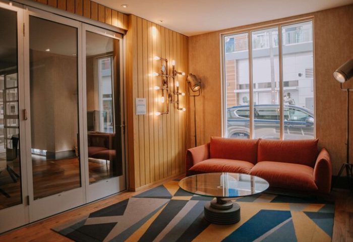 Hyatt Centric The Pike Long Beach stylish hotel room. Modern design, cozy seating area. Gay-friendly hotel, ideal for gay travel.