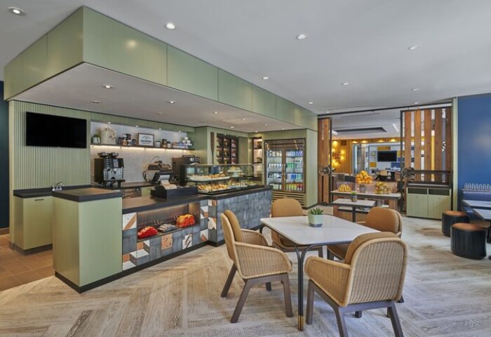 Hyatt Centric The Pike Long Beach's cafe. Gay-friendly hotel with pastries, drinks, and seating. A welcoming space for LGBTQ+ travelers.