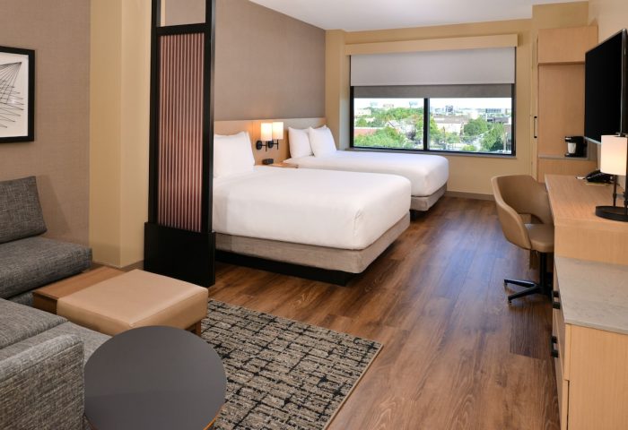 Hyatt Place Chicago/Wicker Park gay-friendly hotel room. Two beds, desk, sofa, and city view. Modern design for gay travelers.