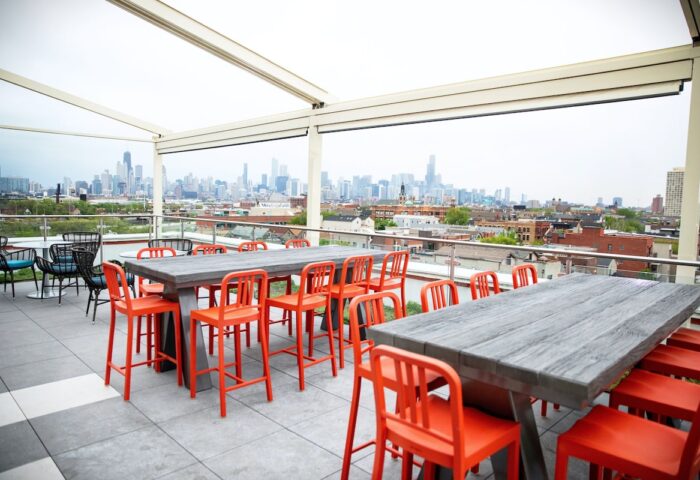 Hyatt Place Chicago/Wicker Park rooftop view. Gay-friendly hotel with outdoor seating and Chicago skyline. Perfect for gay travelers.