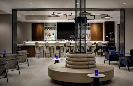 Hyatt Place Montreal Downtown's bar. This gay-friendly hotel features a stylish bar area with modern seating and a well-stocked bar.