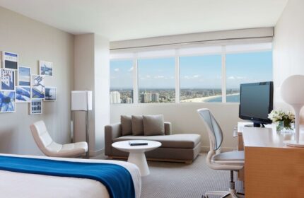 Hyatt Regency Long Beach hotel room. Modern interior with ocean view. Gay-friendly travel in Long Beach, California. Relaxing stay.